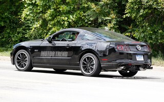 S650 Mustang First Look: S650 Mustang Prototype Spied With Production Body! 📸 2015-Mustang-spy-shots-disguised-as-2013-GT-left-rear-1