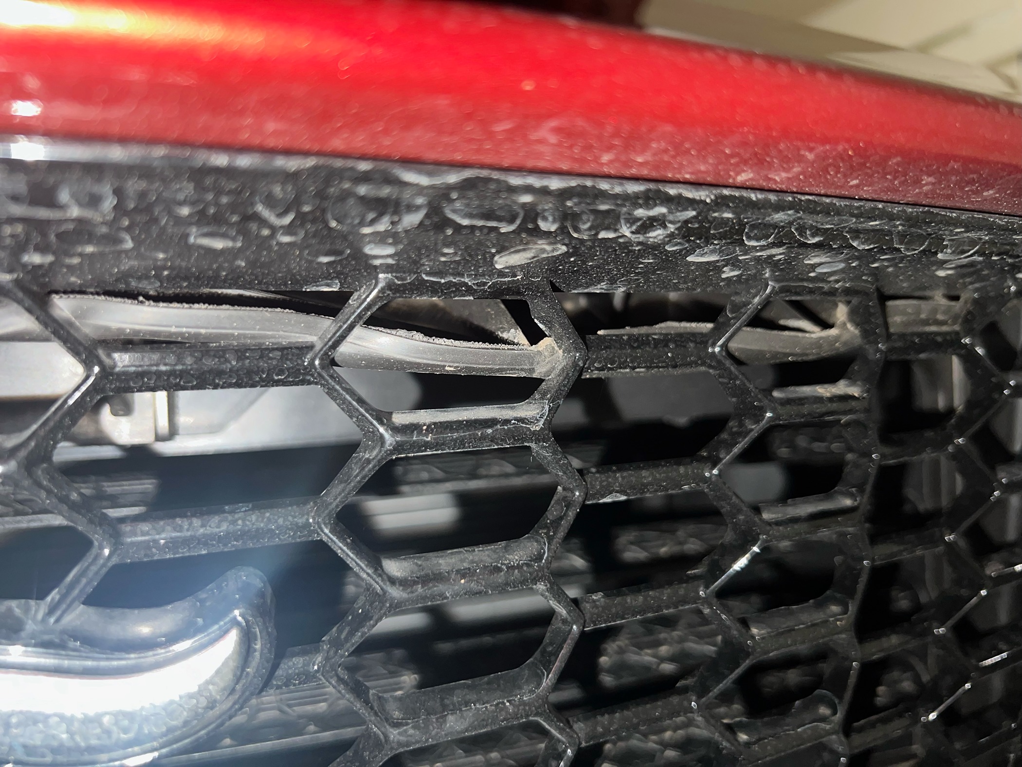 S650 Mustang Rubber piece hanging down behind grille image0 (2)