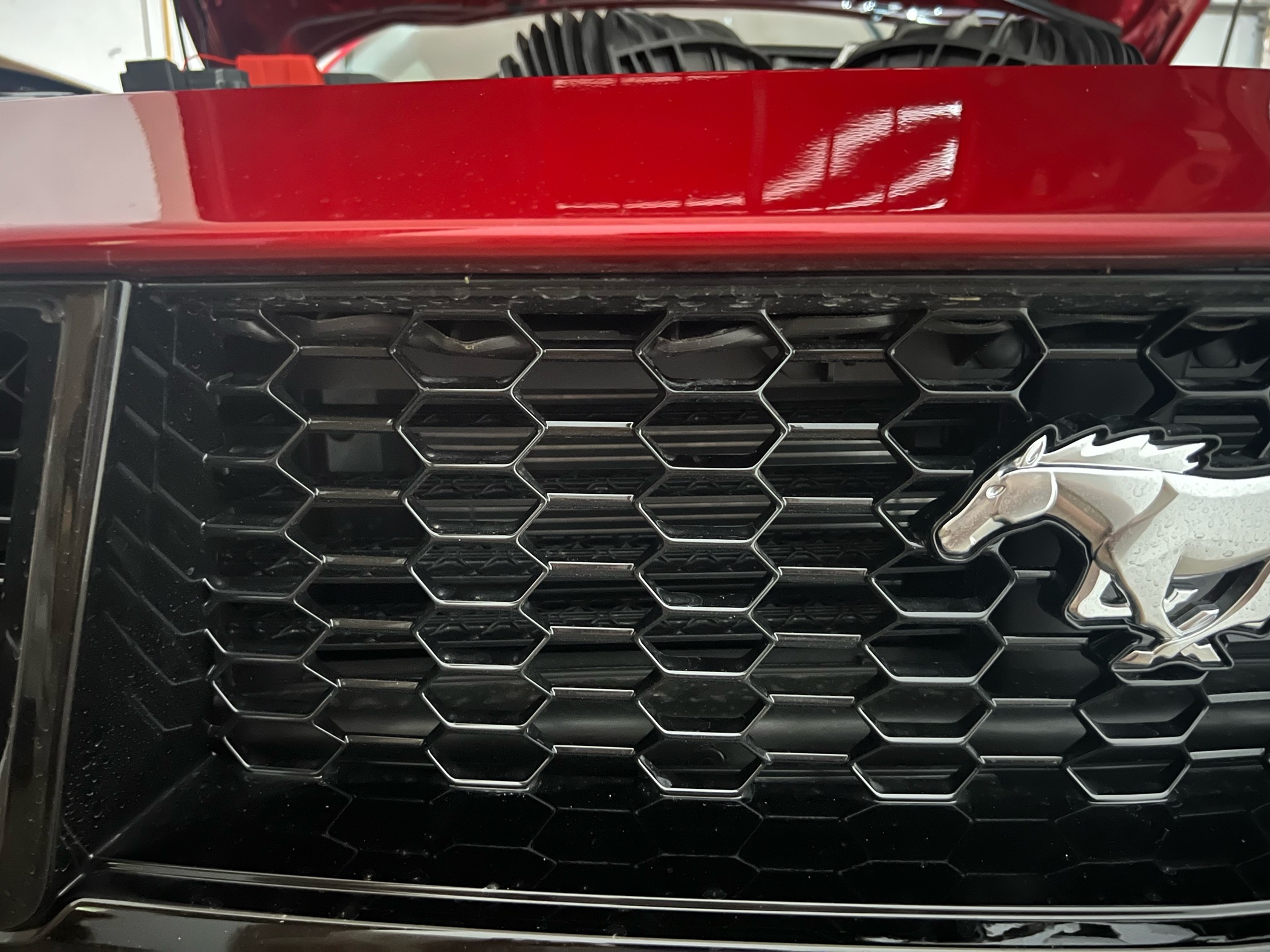 S650 Mustang Rubber piece hanging down behind grille image2
