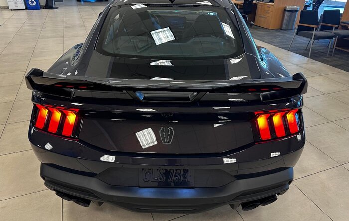 2024 Dark Horse on display at dealer "For Sale" (Blue Ember)